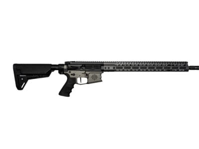 Black modern sporting rifle with an adjustable stock and long quad-rail handguard, pictured side view on white background