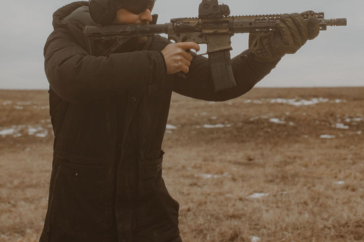 Shooter running a Tier 1 rifle in winter field conditions